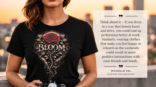 Woman wearing a black Bloom rose graphic tee with quote about how clothing can influence mood, focus and confidence