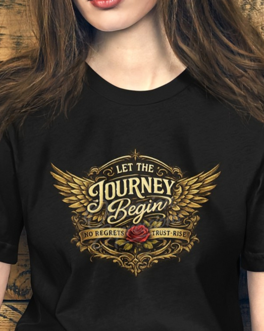 Black t-shirt with gold design featuring text that says "Let the Journey Begin" and a red rose.